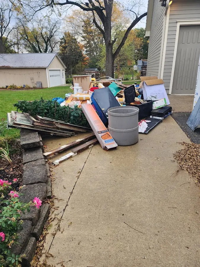 Dumpster being loaded with debris for 3 Yard Dumpster Rental in Standish